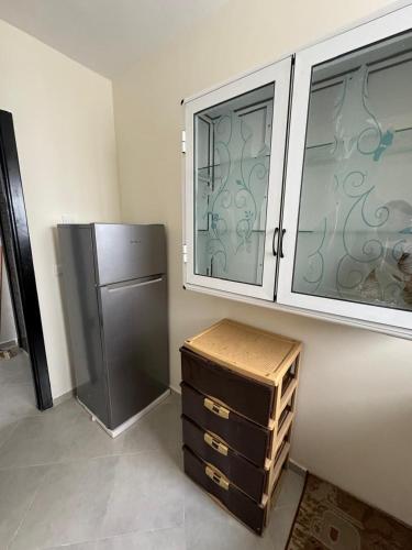a kitchen with a stainless steel refrigerator and cabinets at Ali Vista Vactions in Daidatz