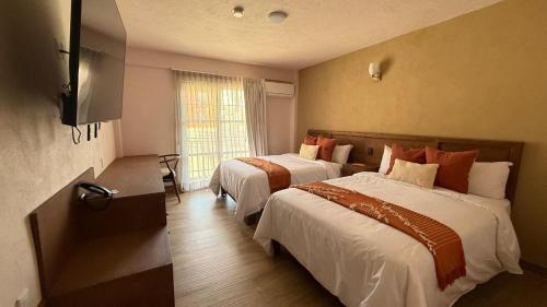 เตียงในห้องที่ Hotel La Querencia