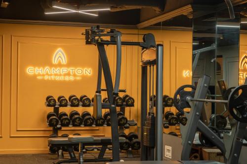 a gym with a bunch of tread machines at Champton Hanoi Hotel in Hanoi