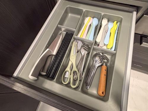 a drawer full of utensils in a drawer at Sky88 Seaview 4BR Indoor Pool-Mahjong-Netflix in Johor Bahru