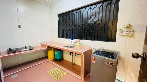 a small kitchen with a sink and a counter at Rinting Masai Semi-D Snooker Ping Pong 6R 20 Paxs in Masai