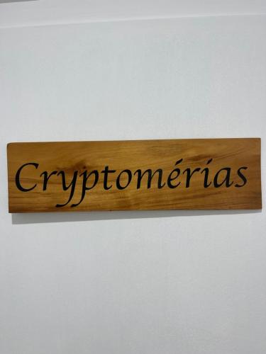 a wooden sign with the word cycoranas on a wall at La Villa Soalic in Cilaos