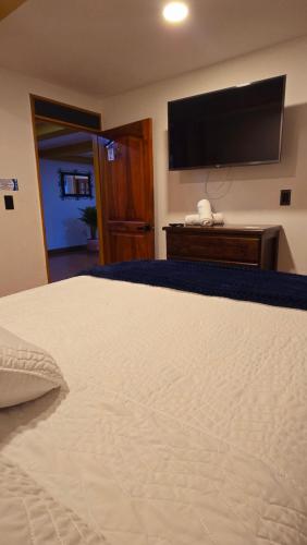 Una cama o camas en una habitación de Hotel Shaddai
