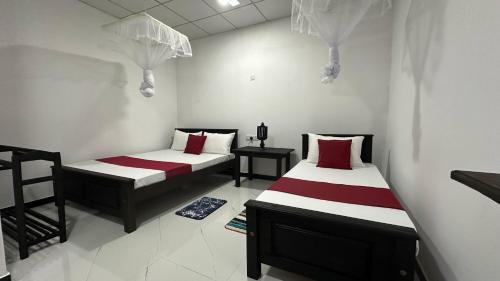 Katil atau katil-katil dalam bilik di Sigiriya White Moon Resort