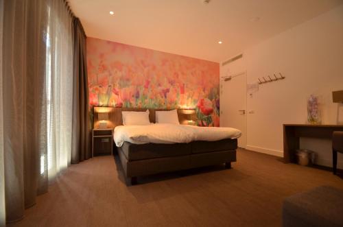 Een bed of bedden in een kamer bij Hotel Restaurant de Engel
