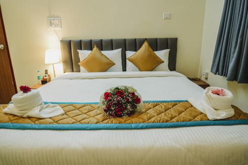 Merry Inn Luxe Suites near Kempegowda international airportにあるベッド