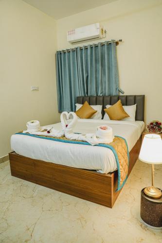 Merry Inn Luxe Suites near Kempegowda international airportにあるベッド