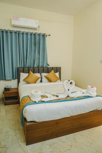 Merry Inn Luxe Suites near Kempegowda international airportにあるベッド