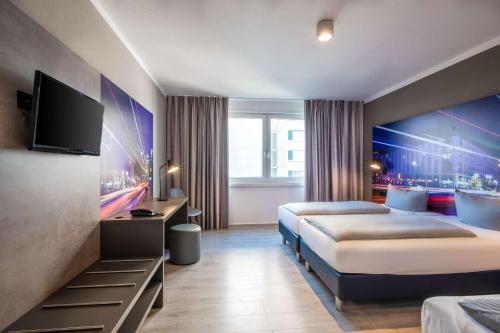 Postel nebo postele na pokoji v ubytování Hotel Berlin Lichtenberg