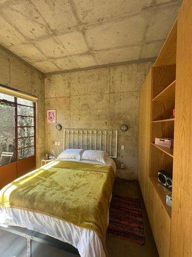 a bedroom with a large bed in a room at Stylish apartment in Chapultepec in Guadalajara