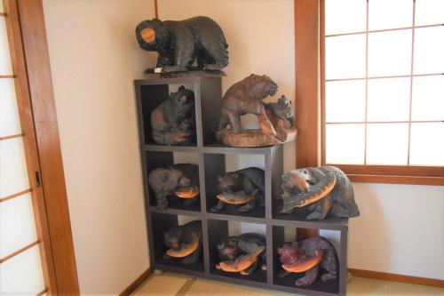 a shelf filled with stuffed animals in a room at Near the sea House 2nd two-story detached house in Hannan