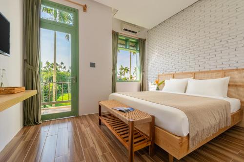 Postel nebo postele na pokoji v ubytování Manling Retreat Hoi An