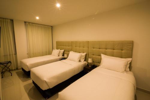 Hotel Parque Del Solにあるベッド
