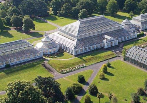 an aerial view of a large building with a garden at TheCountingSheep - Heathrow in 15 mins - Glass Balcony - Dedicated Workspace in Hounslow