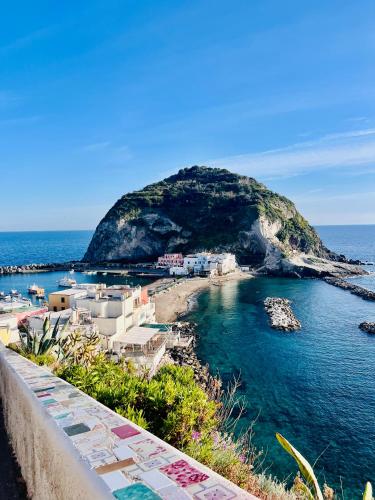 a view of a small island in the ocean at Casa Maadry in Ischia