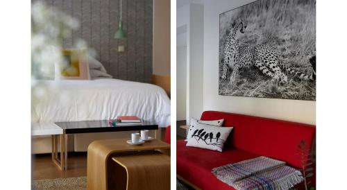 a bedroom with a cheetah and a room with a red couch at 60 Balconies Art in Madrid