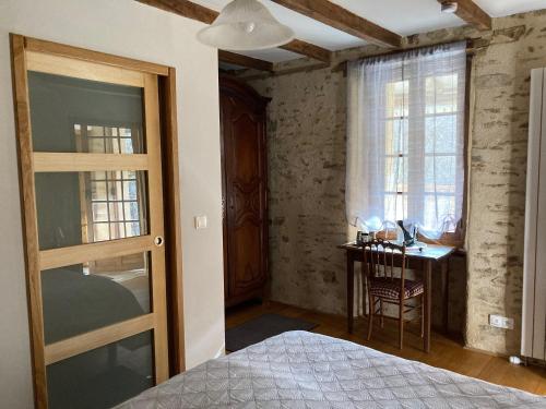 Postel nebo postele na pokoji v ubytování Moulin Lou Apmay
