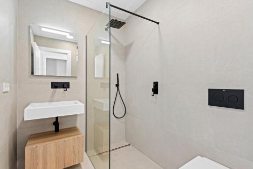 a bathroom with a sink and a shower at Villa Buba in Pilar de la Horadada