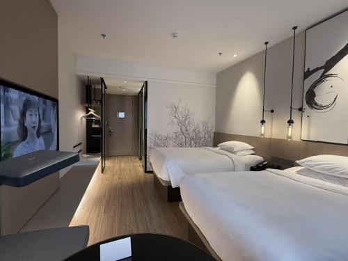 Postel nebo postele na pokoji v ubytování Fairfield by Marriott Kunshan