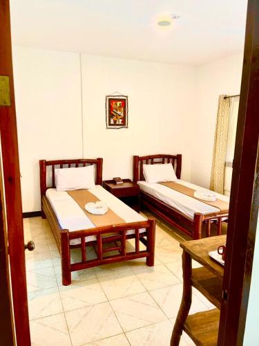 Postel nebo postele na pokoji v ubytování CHIISAI NATSU RESORT