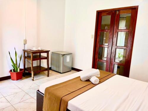 Postel nebo postele na pokoji v ubytování CHIISAI NATSU RESORT