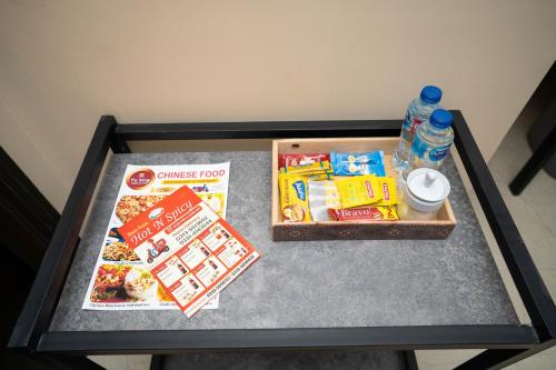 a table with food and drinks on top of it at Just Move Luxury 1BR APT, Near ISB Int'l AIRPT in Islamabad