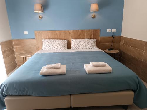 Postel nebo postele na pokoji v ubytování Hotel Il Roscio
