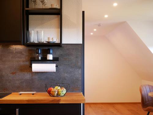 a kitchen with a bowl of fruit on a counter at Rinken9 in Hinterzarten