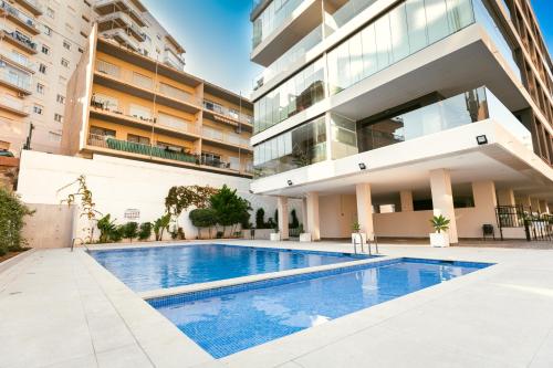 a swimming pool in front of a building at CostaBlancaDreams Calpe Beach 2 6O in Calpe in Calpe