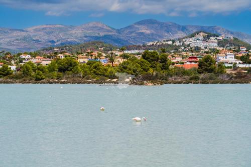 a large body of water with a town in the background at CostaBlancaDreams Calpe Beach 2 6O in Calpe in Calpe