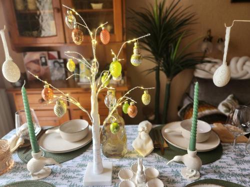 a table with christmas ornaments and ornaments on top of it at Sophia Apartment Triora in Triora
