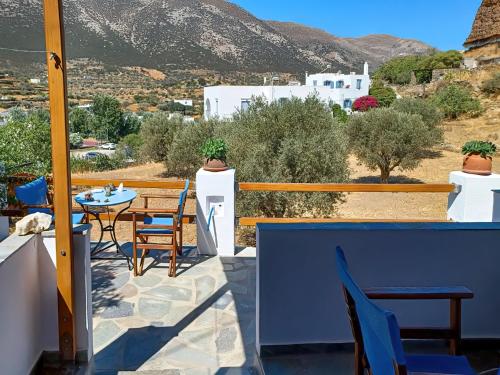 a balcony with a table and chairs and a view at Katerina Studios Mparou in Apollonia