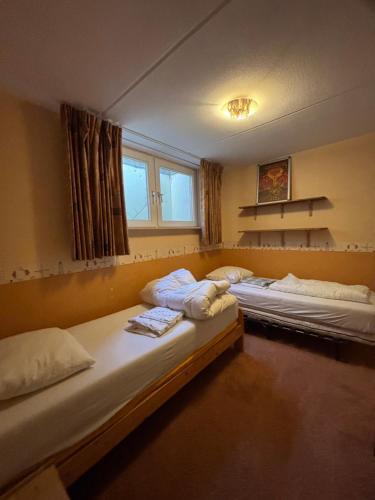 Postel nebo postele na pokoji v ubytování Vakantiehuis Petrarca