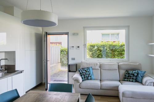 a living room with a couch and a table at Agata House in Colico