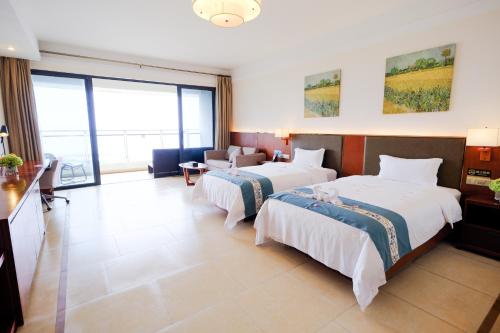 Katil atau katil-katil dalam bilik di Huizhou Hazens East Bay Resort