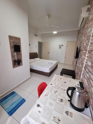 Ένα ή περισσότερα κρεβάτια σε δωμάτιο στο Melaka Stay