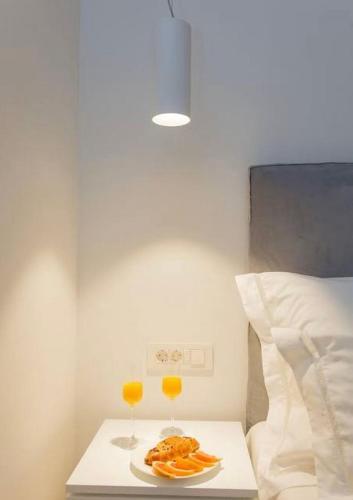 Ein Bett oder Betten in einem Zimmer der Unterkunft Bifora Heritage Hotel