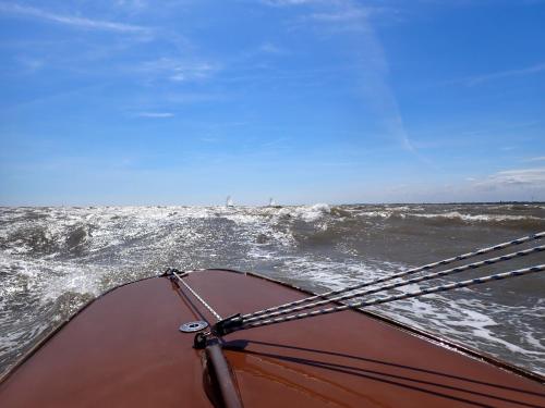 a boat in the water with a rope at Royal Norfolk & Suffolk Yacht Club in Lowestoft