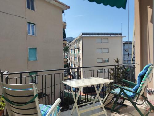 a balcony with chairs and a table on a balcony at Casa del Celo in Rapallo