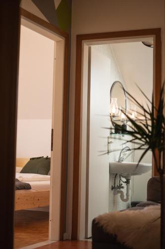 Ένα ή περισσότερα κρεβάτια σε δωμάτιο στο Am See Apartments