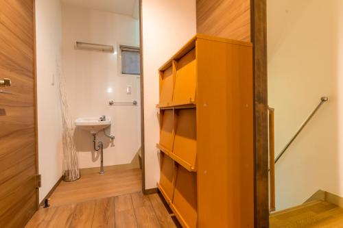 a bathroom with a toilet and a sink at Tasuki in Tokyo