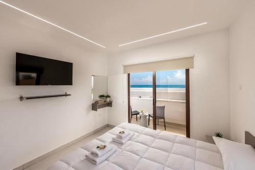 Cama o camas de una habitación en SEVIS SUITES