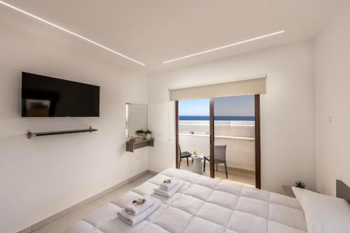 Cama o camas de una habitación en SEVIS SUITES