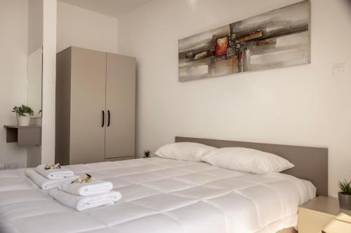 Cama o camas de una habitación en SEVIS SUITES