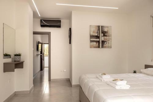 Cama o camas de una habitación en SEVIS SUITES