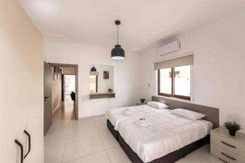 Cama o camas de una habitación en SEVIS SUITES