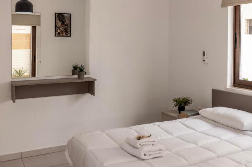 Cama o camas de una habitación en SEVIS SUITES