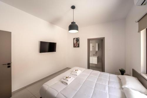 Cama o camas de una habitación en SEVIS SUITES