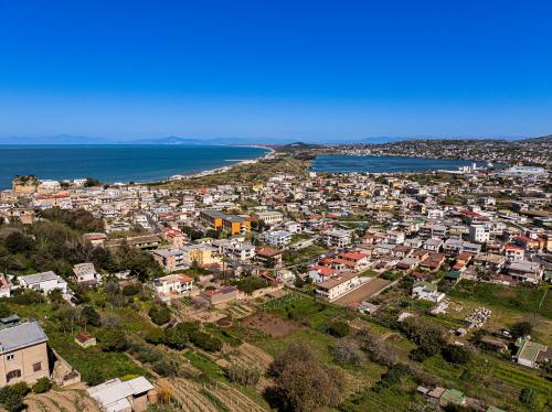 an aerial view of a city next to the ocean at Uefio - Luxury Suites in Monte di Procida
