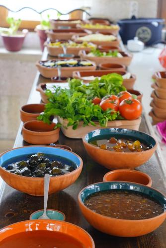 a group of bowls of food on a table at Glory Art Stone House in Goreme